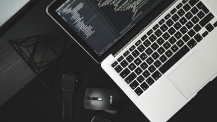 Image of a desk with laptop on